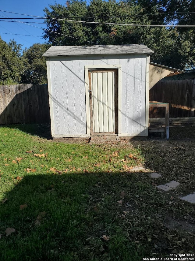 view of shed with a fenced backyard