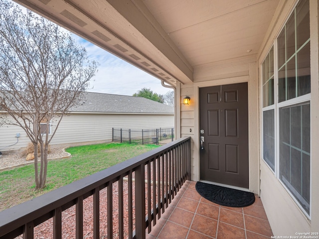 view of exterior entry featuring covered porch