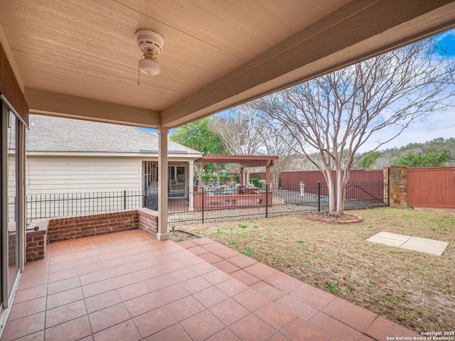 view of patio with a fenced backyard and ceiling fan