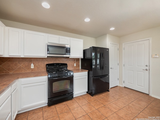 kitchen featuring black appliances, tasteful backsplash, white cabinetry, and recessed lighting