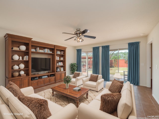 living area with light tile patterned floors and a ceiling fan