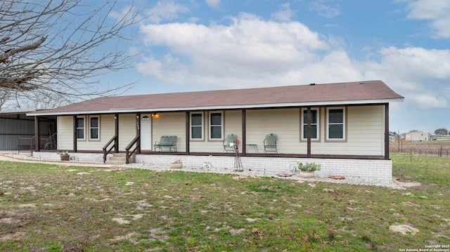 view of front of home featuring a porch and a front yard