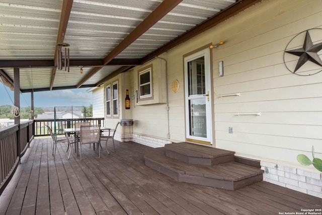 wooden deck with outdoor dining space