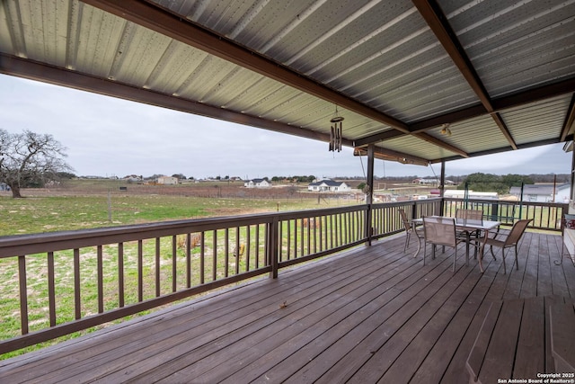 wooden deck featuring outdoor dining area