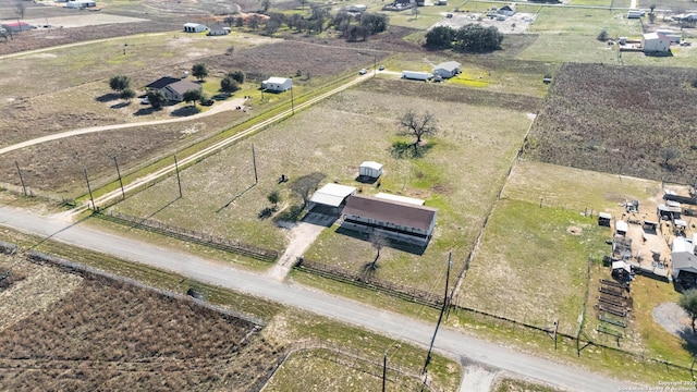 birds eye view of property with a rural view