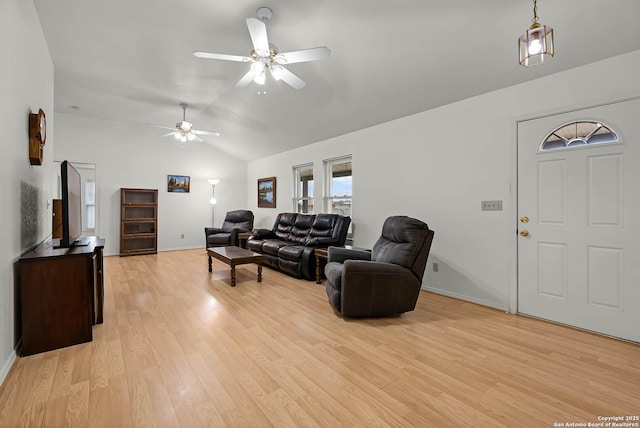 living area with a ceiling fan, lofted ceiling, baseboards, and light wood finished floors