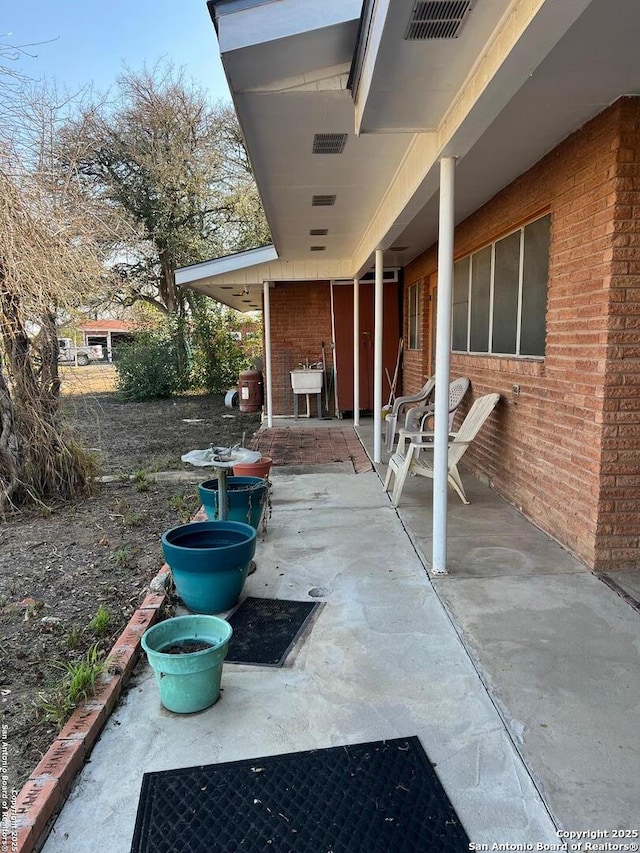 view of patio featuring visible vents