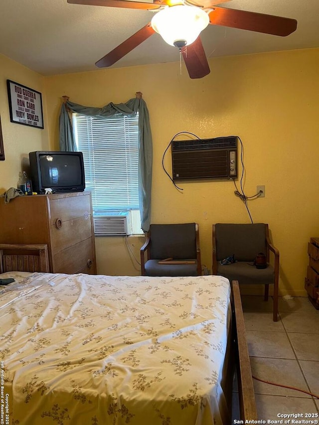 tiled bedroom featuring an AC wall unit and ceiling fan