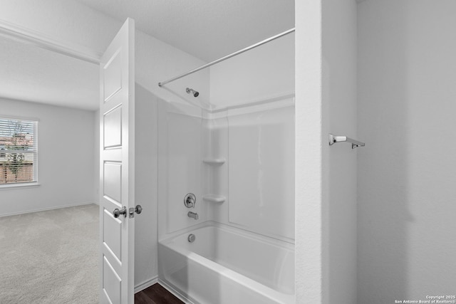 full bathroom with baseboards and shower / bathtub combination