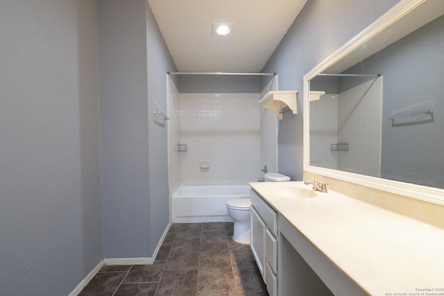 bathroom with shower / washtub combination, baseboards, vanity, and toilet