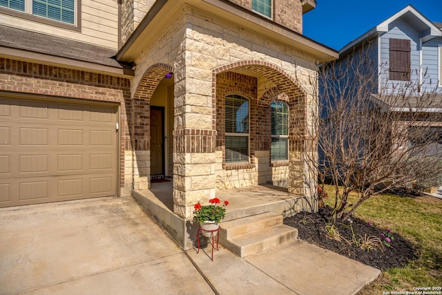 entrance to property featuring stone siding, brick siding, covered porch, and driveway