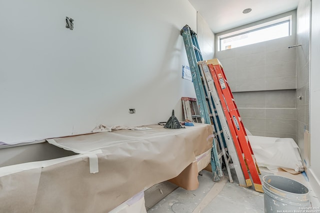 interior space with unfinished concrete floors