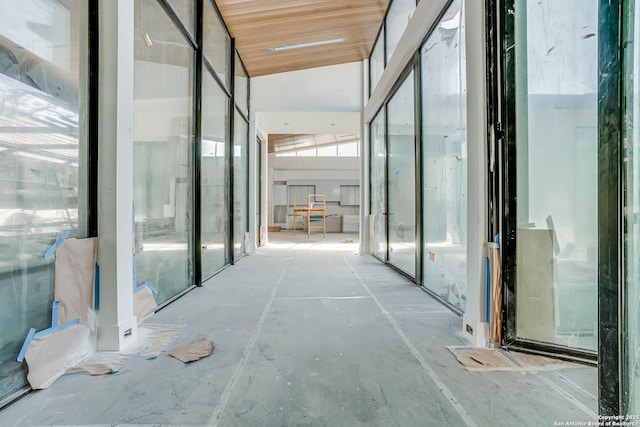 hallway featuring a high ceiling