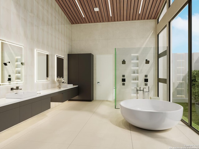 bathroom featuring wood ceiling, tile patterned flooring, a tile shower, vanity, and tile walls