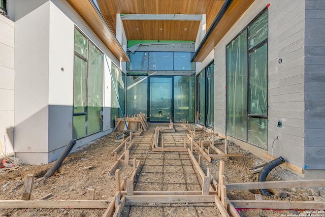 interior space featuring wood walls and wood ceiling