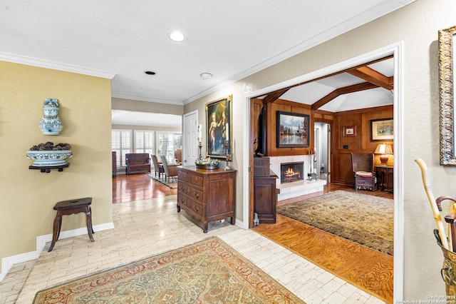 hall featuring baseboards, lofted ceiling with beams, recessed lighting, and crown molding