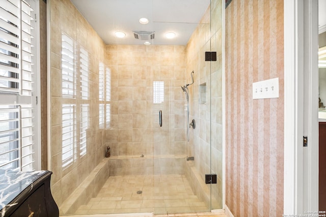 full bath featuring a stall shower, visible vents, and vanity