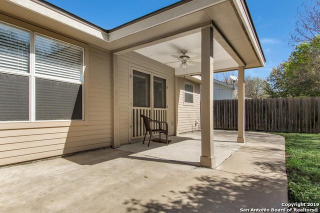 view of patio / terrace with fence and a ceiling fan