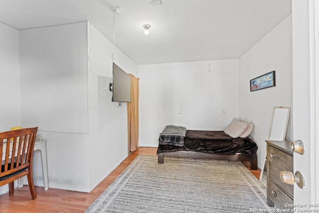 bedroom with light wood-style floors