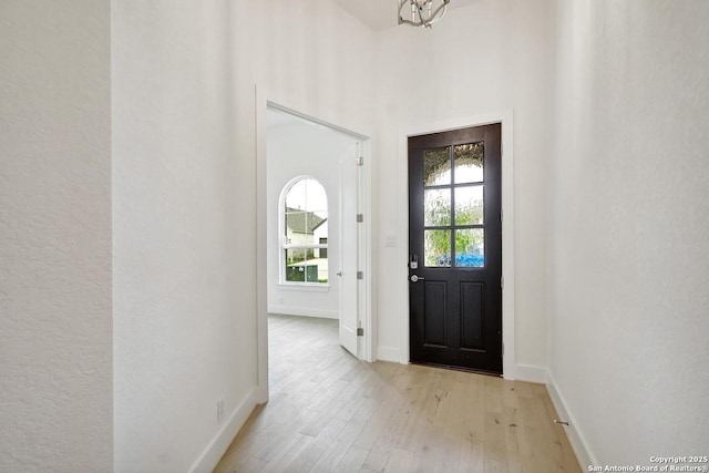 12440 Lanthimos, San Antonio, TX 78254 - foyer entrance featuring baseboards and light wood finished floors