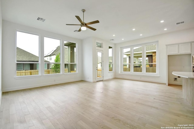 12440 Lanthimos, San Antonio, TX 78254 - unfurnished living room featuring ceiling fan, visible vents, and baseboards