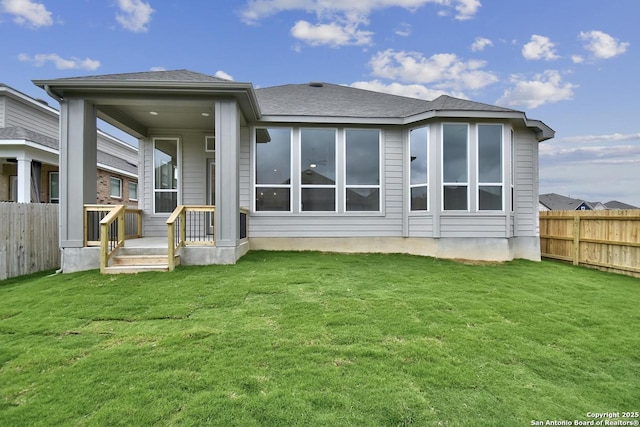 12440 Lanthimos, San Antonio, TX 78254 - back of property with a fenced backyard, roof with shingles, and a yard
