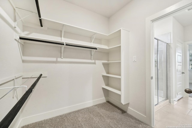 spacious closet featuring light carpet and visible vents