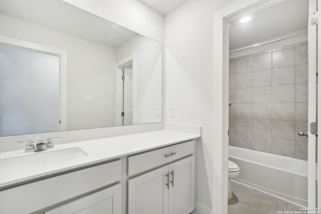 full bath with  shower combination, tile patterned flooring, vanity, and toilet