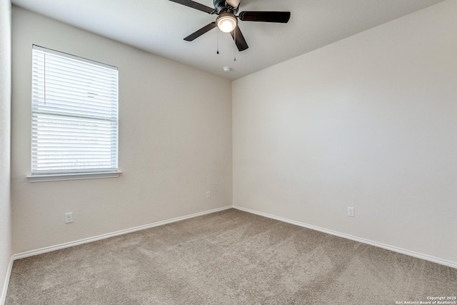 unfurnished room featuring carpet, a ceiling fan, and baseboards