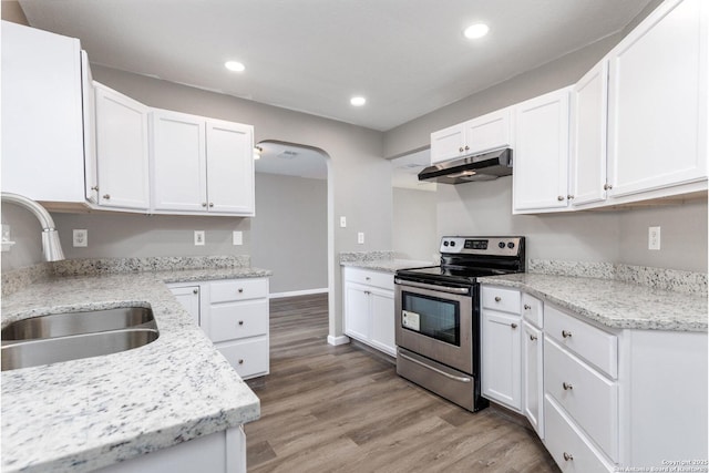 kitchen with white cabinetry, a sink, stainless steel range with electric stovetop, and under cabinet range hood