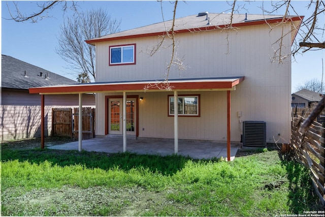 back of house featuring fence, a patio, and central air condition unit