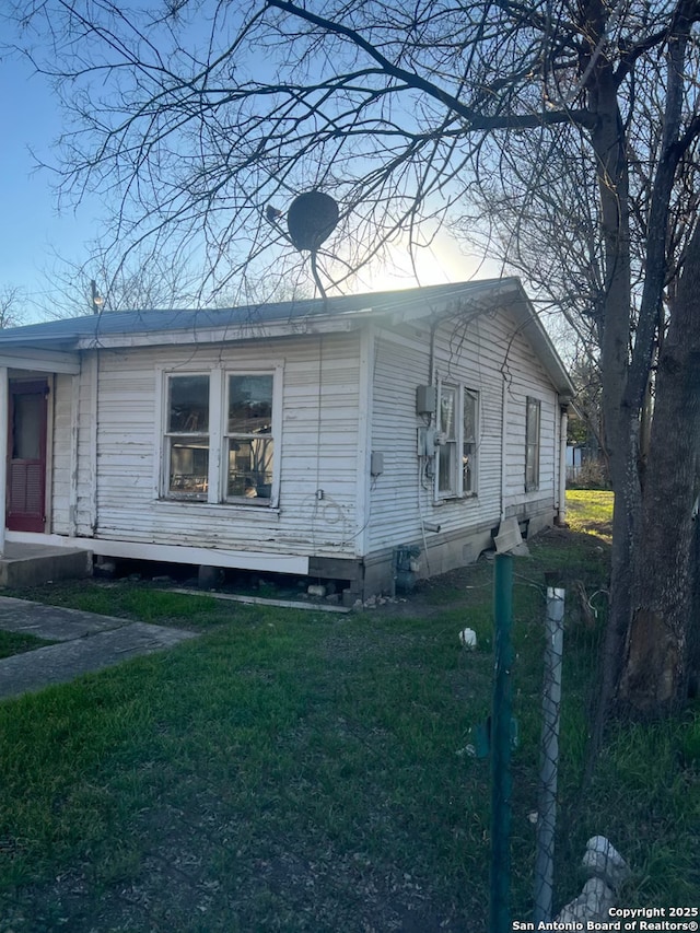 view of home's exterior featuring a yard