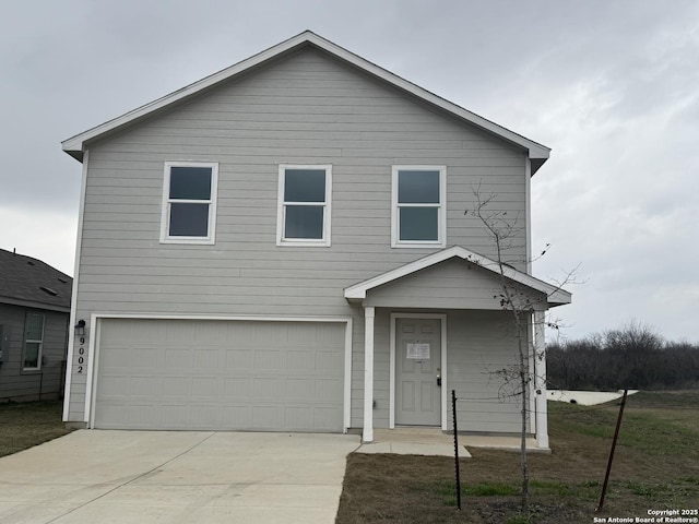 traditional-style home with a garage and driveway