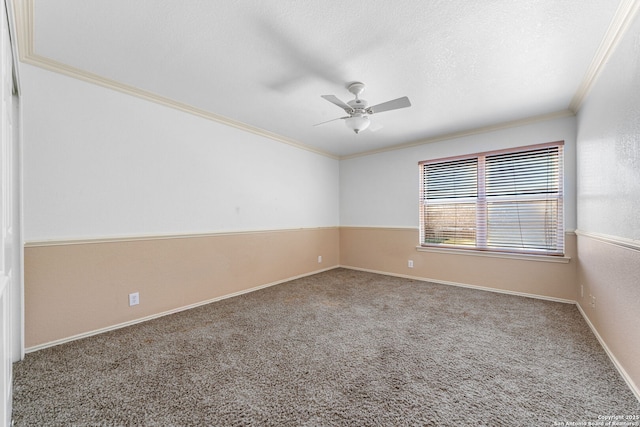 carpeted empty room with a textured ceiling, ceiling fan, baseboards, and crown molding