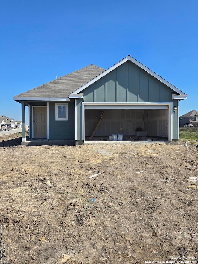 view of front facade featuring board and batten siding and an attached garage