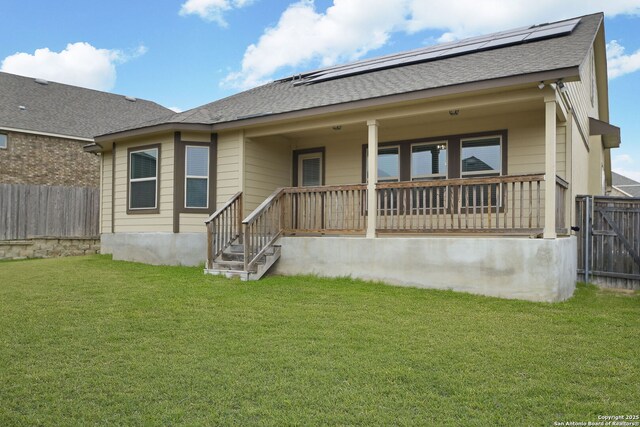 13818 Cessna, San Antonio, TX 78245 - back of property featuring a shingled roof, fence, a porch, and a lawn