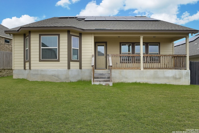 13818 Cessna, San Antonio, TX 78245 - rear view of house with a shingled roof, a lawn, and fence