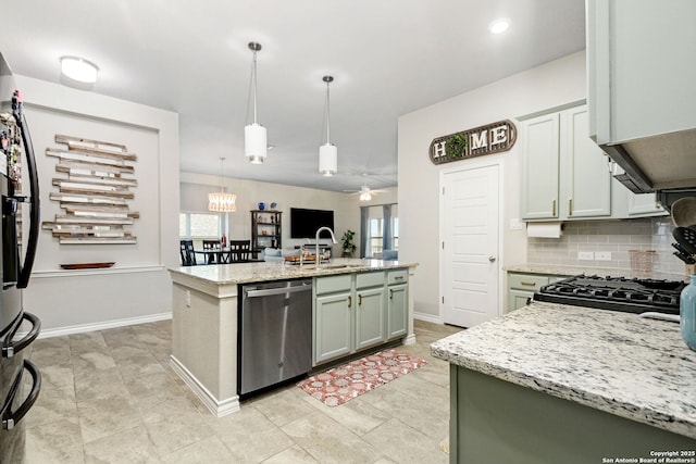 13818 Cessna, San Antonio, TX 78245 - kitchen featuring tasteful backsplash, dishwasher, light stone countertops, a kitchen island with sink, and pendant lighting