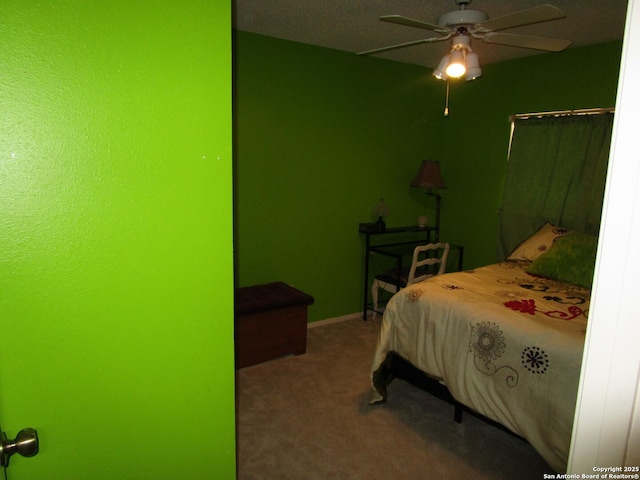 bedroom with ceiling fan, carpet, and baseboards