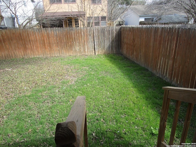 view of yard featuring a fenced backyard