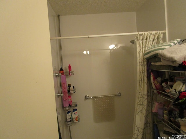 bathroom with a shower with shower curtain