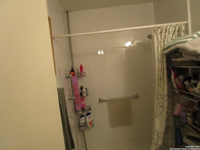 bathroom with a shower with curtain