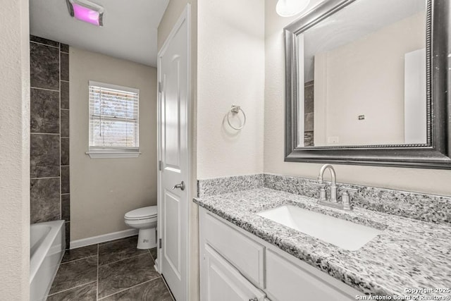 full bath with toilet, tile patterned floors, baseboards, and vanity