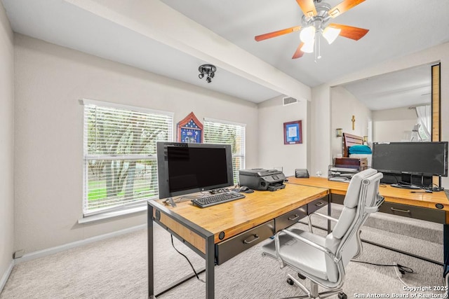 carpeted office featuring baseboards, visible vents, ceiling fan, and beamed ceiling