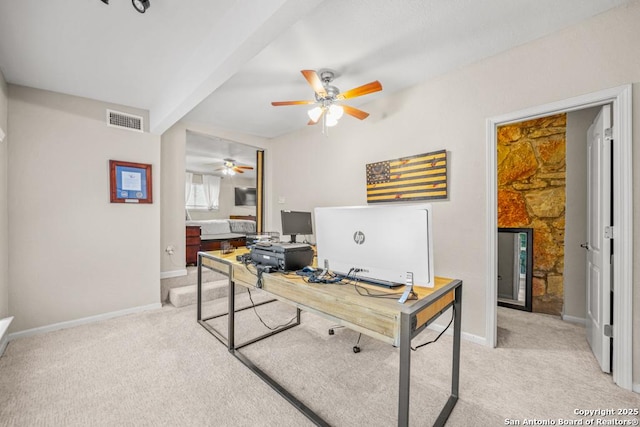 office area featuring visible vents, ceiling fan, light carpet, and baseboards