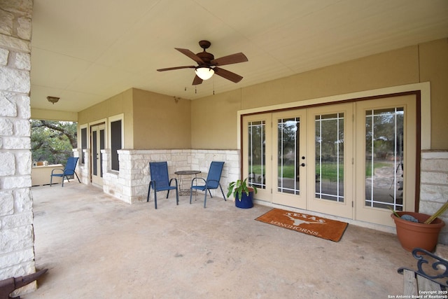 view of patio / terrace featuring a ceiling fan and french doors