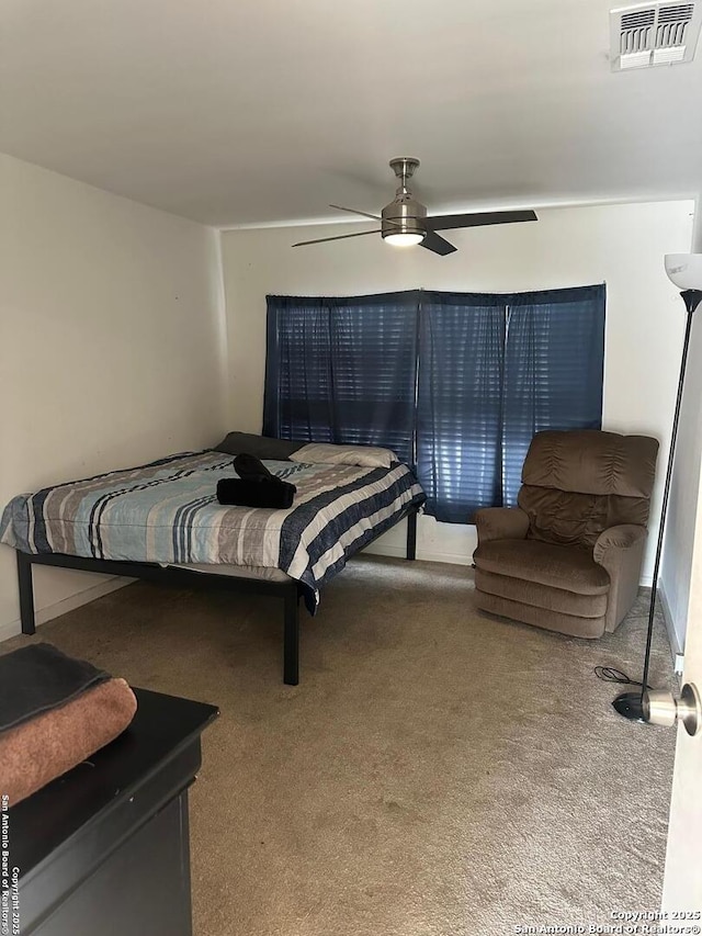 bedroom with ceiling fan, carpet flooring, and visible vents