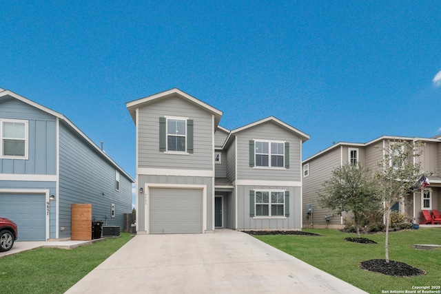 traditional-style house with board and batten siding, a front yard, driveway, and a garage