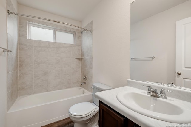 full bath featuring  shower combination, vanity, and toilet