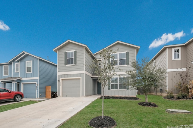 traditional-style home featuring board and batten siding, a front lawn, driveway, and a garage